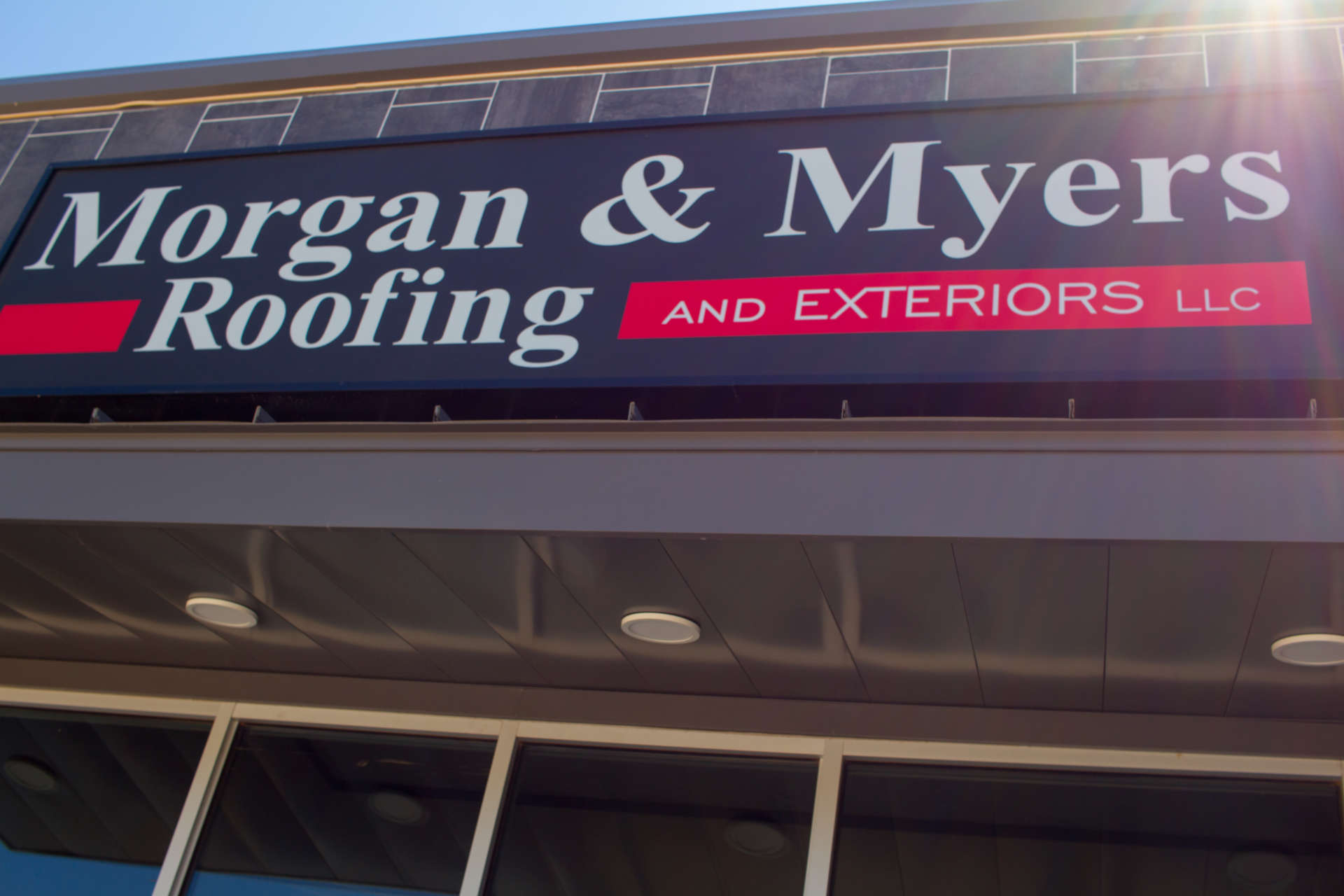 Morgan & Myers Roofing and Exteriors Signage above entrance with sunray
